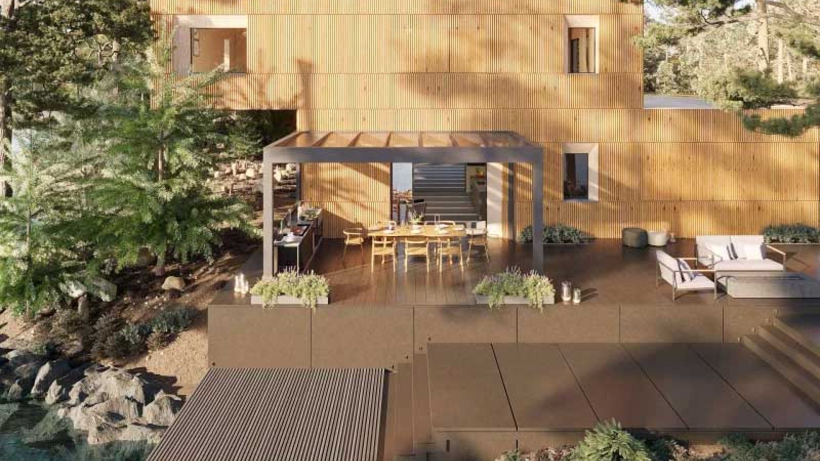 Ein Terrassen Glasdach auf einen großen Terrassenbereich aus Holz.